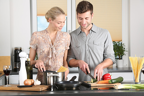 A woman and a man preparing a meal